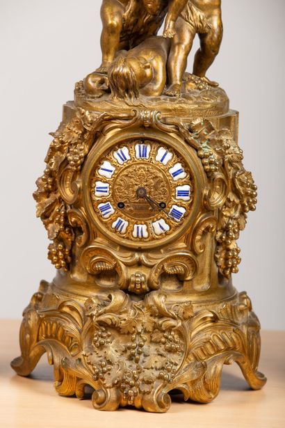 null Gilded bronze mantelpiece with harvesting bears including: a clock richly decorated...
