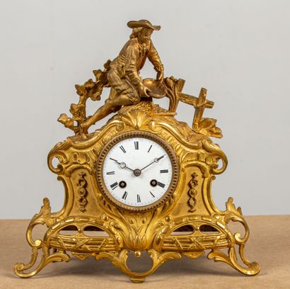 null Romantic clock in gilt bronze, featuring a young peasant collecting vegetables.
White...