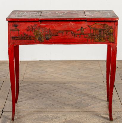 null Black and gold lacquered wood dressing table on a red background, with Chinese...