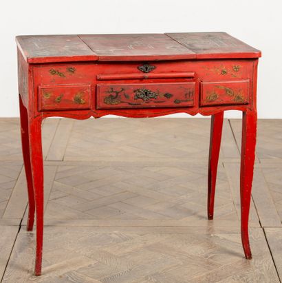 null Black and gold lacquered wood dressing table on a red background, with Chinese...