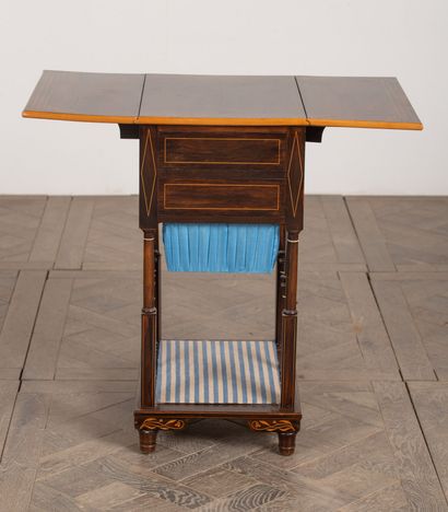 null Table with books in rosewood veneer and light wood marquetry. The base with...