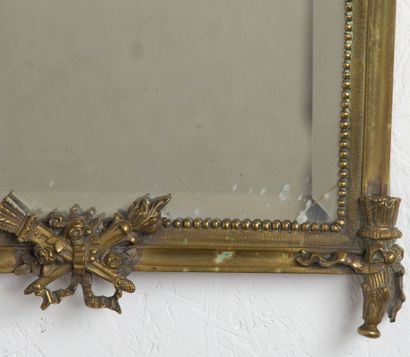 null A Louis XVI style bronze hanging mirror.
End of the XIXth century.
H_49 cm L_35,5...