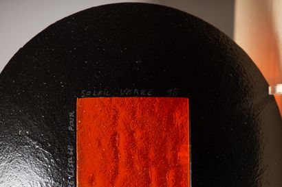 null Claire LE SAGE for SOLEIL VERRE. 
Circular cup in black and orange tinted glass....