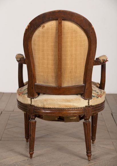 null Armchair in molded and carved wood.
Louis XVI period.
Upholstered with antique...