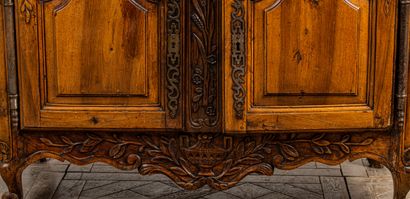 null Buffet with sliding Provencal walnut richly carved and molded.
It opens with...