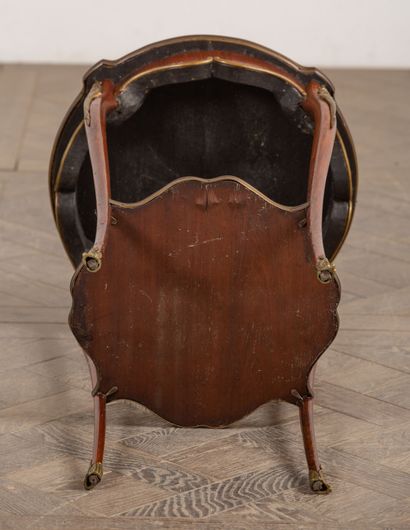 null Living room table in rosewood veneer, the top in red marble, ormolu ornamentation.
Louis...