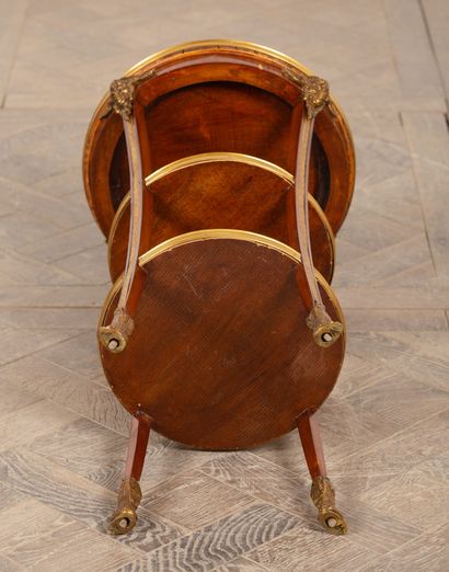 null Pedestal table in rosewood veneer and gilt bronze ornamentation with ram heads.
Louis...