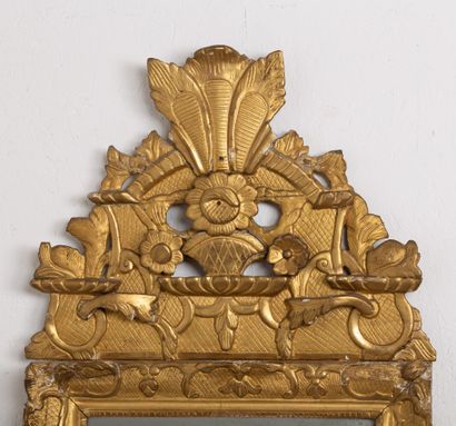 null Carved and gilded wood mirror with pediment.
18th century.
H_102 cm L_53 cm,...