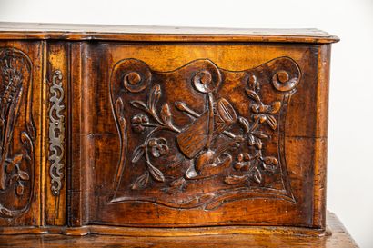 null Buffet with sliding Provencal walnut richly carved and molded.
It opens with...