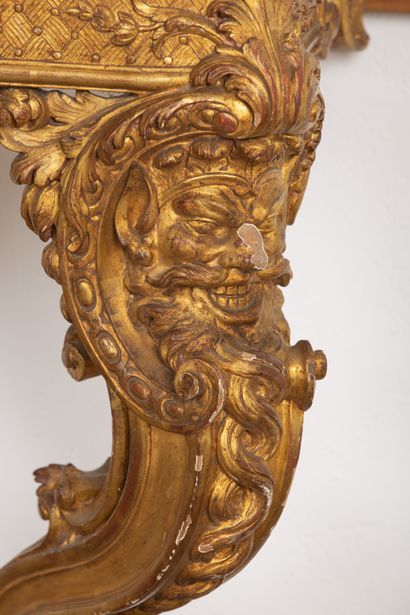 null Beautiful console in molded wood, carved and gilded. 
The belt decorated with...