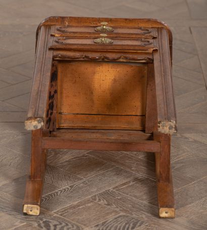 null Bedside table in molded and carved wood, opening with two drawers.
18th century.
H_75...