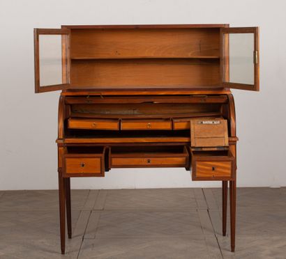 null Happiness desk in light wood and mahogany veneer.
It opens with a cylinder on...