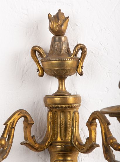 null Pair of gilt bronze sconces with two lights, topped by a fire pot.
Period Louis...