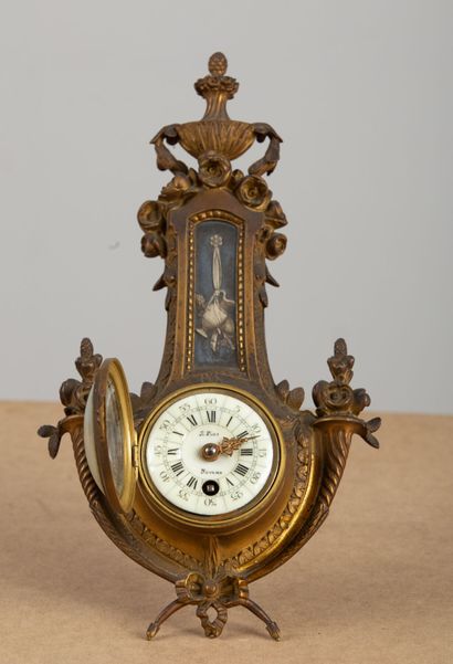null Table clock, in the form of a barometer, in gilt bronze and cookie application...