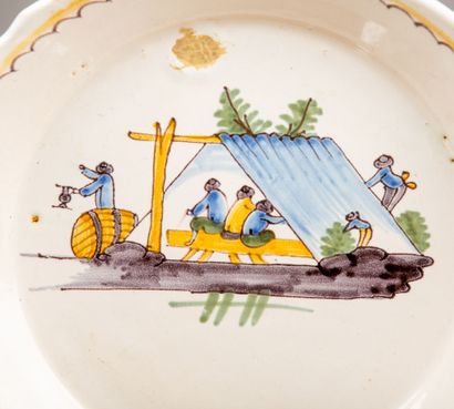 null NEVERS.
Earthenware plate with polychrome decoration of drinkers under a tent.
18th...