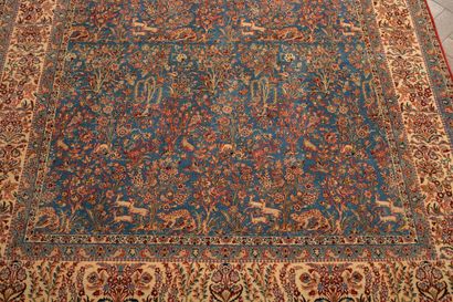 null IRAN.
Wool and silk carpet decorated with earthly paradise on a blue background.
Signed...