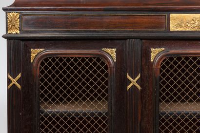 null Bookcase in dark rosewood veneer and gilded bronze ornamentation, including...
