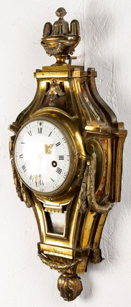 null Wall clock in chased and gilded bronze decorated with garlands and vase at the...