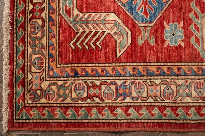 null Wool carpet KAZAKH with red background.
L_206 cm l_123 cm.