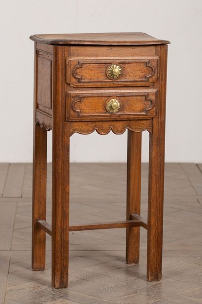 null Bedside table in molded and carved wood, opening with two drawers.
18th century.
H_75...