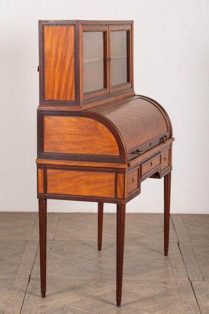 null Happiness desk in light wood and mahogany veneer.
It opens with a cylinder on...