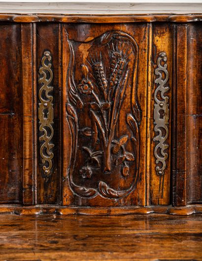 null Buffet with sliding Provencal walnut richly carved and molded.
It opens with...