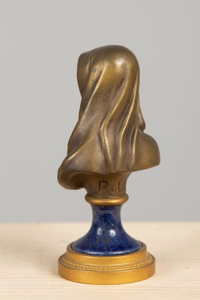 null Armand ROBLOT (1890-1983).
Bust of a saint holding a lily.
Bronze with medal...