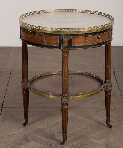 null Pedestal table in marquetry of veneer and blackened wood.
White veined marble...