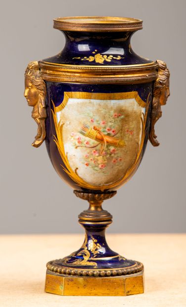 null SEVRES, in the taste of.
Pair of porcelain vases with polychrome decoration...