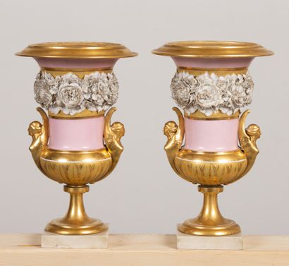 null PARIS, 
Pair of porcelain and cookie vases, pale pink background and gilding.
They...