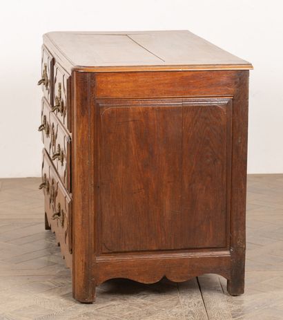 null Parisian chest of drawers in light oak, molded and carved, opening to four drawers...