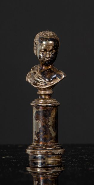 null Silver-plated bronze seal, depicting a bust of a young Nubian on a column.
Figured.
Second...