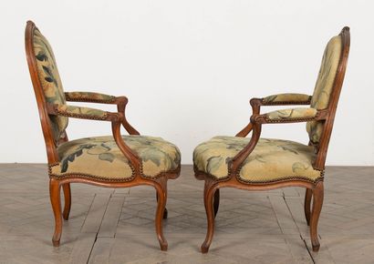 null Suite of four Queen-size beechwood armchairs, molded and carved with flowers.
Each...