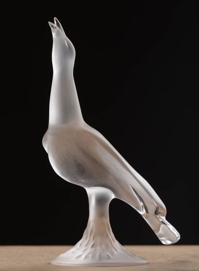 null LALIQUE France.
Bird in pressed molded glass, partially frosted.
Signed at the...