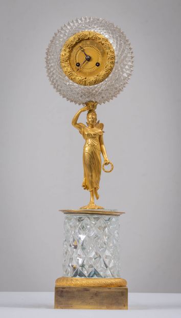null Cut crystal and gilt bronze clock.
A vestal with butterfly wings supports a...