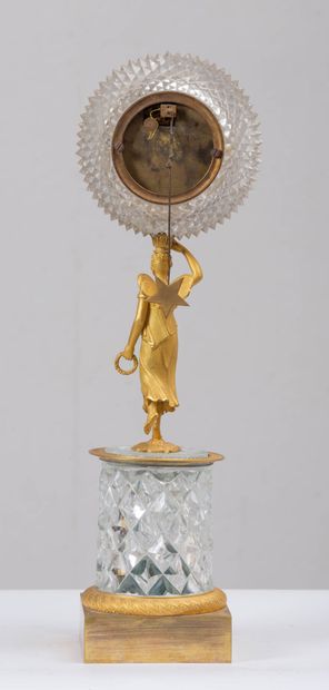 null Cut crystal and gilt bronze clock.
A vestal with butterfly wings supports a...
