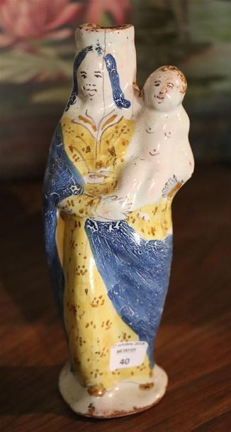 null NEVERS.

Vierge d'accouchée en faïence.

XVIIIème siècle.

H_19 cm, restaur...