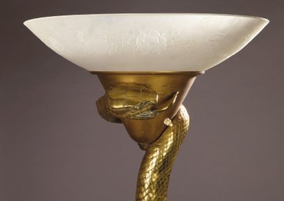 D'après EDGAR BRANDT (1880-1960) 
LAMPADAIRE «La Tentation» en bronze représentant...
