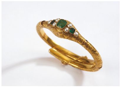 null Rigid opening BRACELET decorated with three small emeralds and half pearls on...