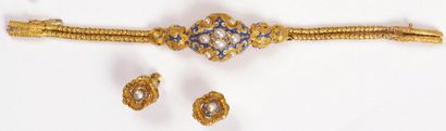 null SET in yellow gold, comprising a bracelet, a brooch and a pair of earrings in...