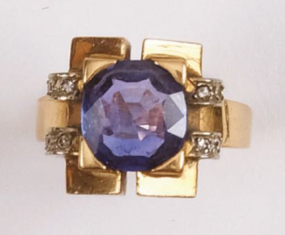 null RING in yellow gold adorned with a round sapphire brilliant-cut in the centre...