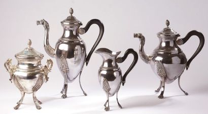 null TEA COFFEE SERVICE four pieces in silver in the shape of a tripod baluster with...