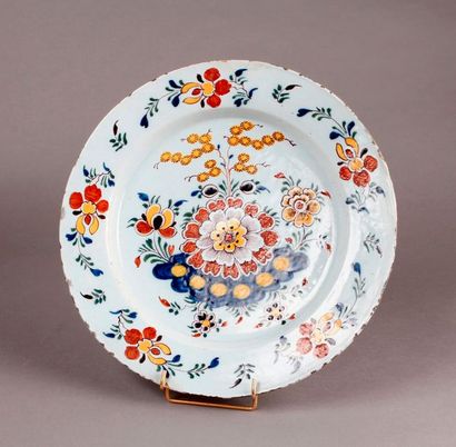 DELFT Round earthenware dish with polychrome decoration of flowers and shrubs on...