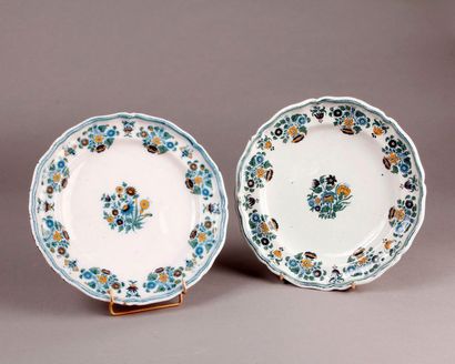 MOUSTIERS Two earthenware plates with contoured edges with polychrome decoration...