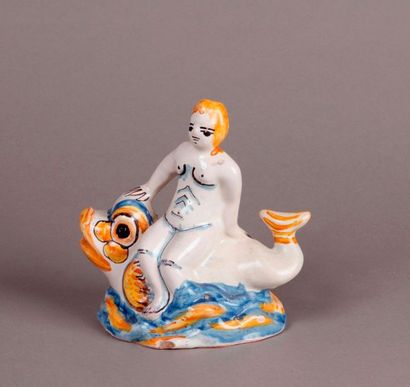 null NEVER. Earthenware group representing a child sitting on a dolphin with polychrome...