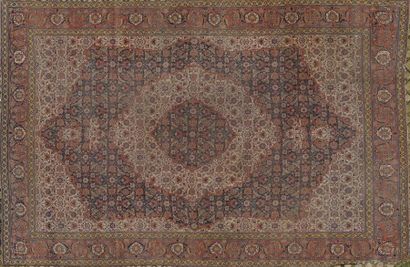 TEBRIZ Large CARPET with blue and red central medallion on beige background (worn).
400...