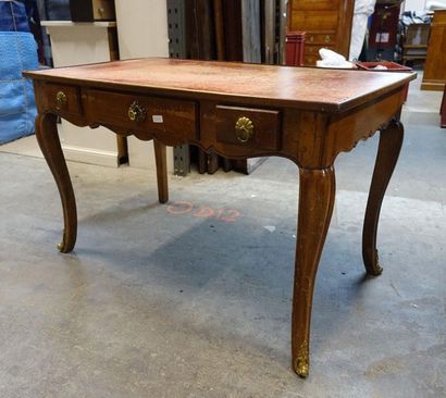 null Walnut flat desk, opening with three drawers in belt, resting on cambered legs,...