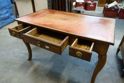 null Walnut flat desk, opening with three drawers in belt, resting on cambered legs,...