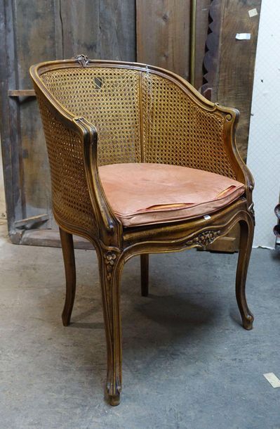 null Caned gondola office armchair in moulded walnut, carved with flowers, arched...