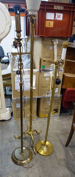 null Tripod floor lamp and two articulated brass reading lamps.

20th century.

H....